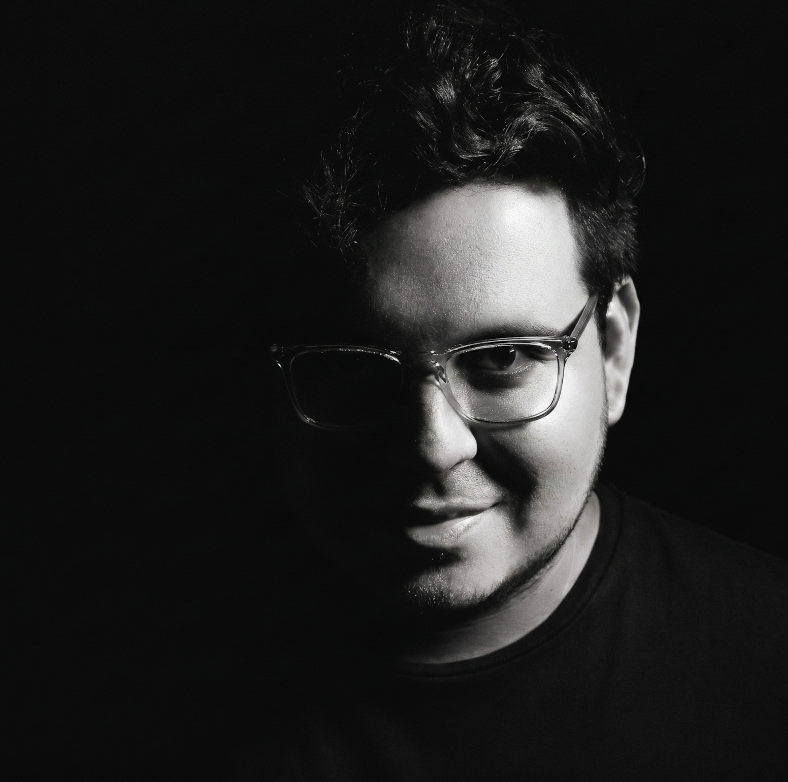 Portrait of Daniel F. Parra, behavioral and experimental economist, in low light